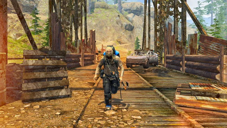 A survivor crosses a wooden railway bridge in the forest.