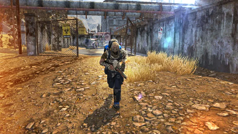 A survivor runs out of a fenced industrial outpost.